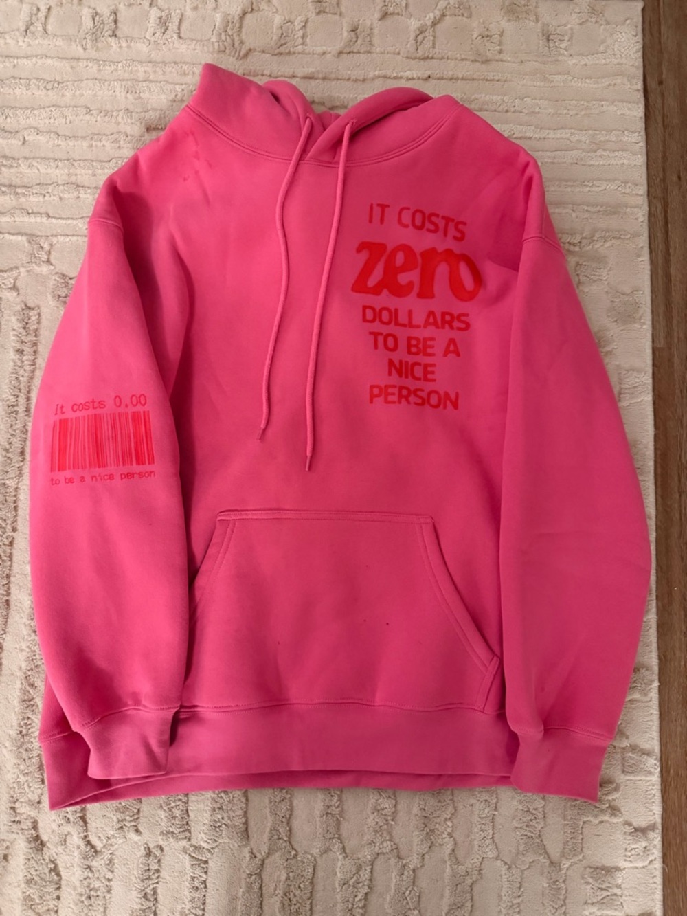 Revolve Pink Graphic Hoodie — "It Costs Zero Dollars"